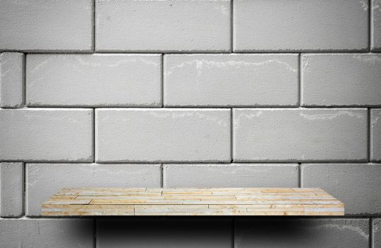 yellow stone rock shelf counter on gray brick for product display
