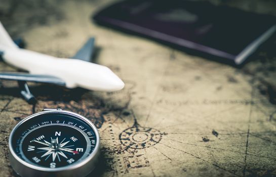 Compass and traveler equipment on vintage map