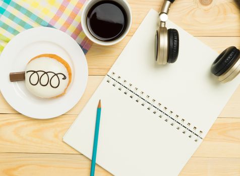 Music writing equipment on a sweet cafe table