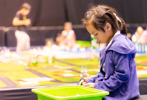 Asian girl and boy is playing with educational toy