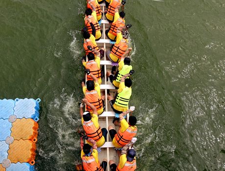 KAOHSIUNG, TAIWAN - MAY 25, 2014: An unidentified team competes in the 2014 Dragon Boat Races on the Lotus Lake.