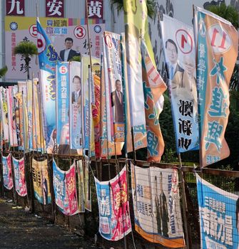 KAOHSIUNG, TAIWAN -- NOVEMBER 28, 2014: Local election 2014 in Taiwan. A veritable forest of election flags promotes the candidates of the various parties.
