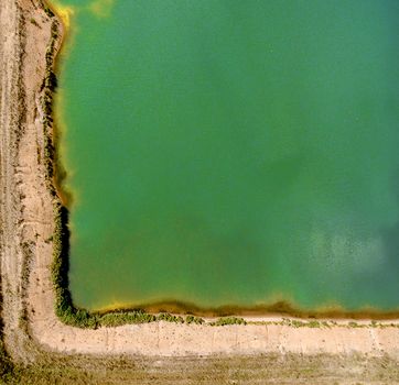 Corner of a gravel pit, abstract effect by perpendicular recording with the drone, as a background with free space