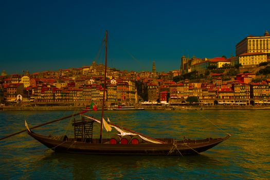 Typical portuguese wooden boats, called barcos rabelos, used in the past to transport the famous port wine (Porto-Oporto-Portugal-Europe) - dusk toned image.