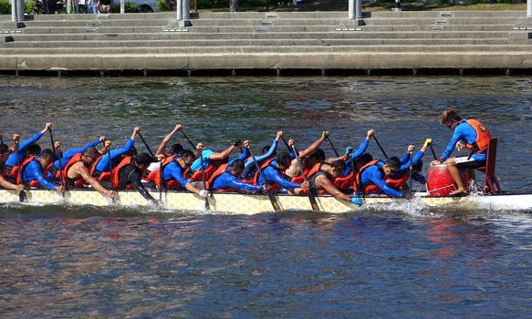 KAOHSIUNG, TAIWAN -- JUNE 14, 2015: An unidentified team of rowers trains for the upcoming Dragon Boat Races on the Love River.