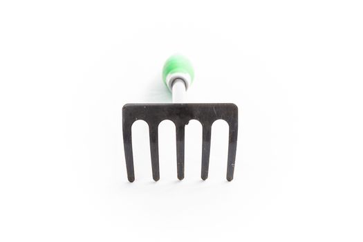 small rake gardening 5 teeth with green handle on white background