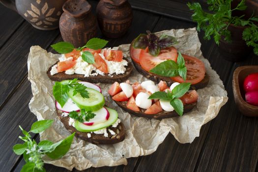Assorted bruschetta with various toppings. Appetizing bruschetta or sandwiches. Mix