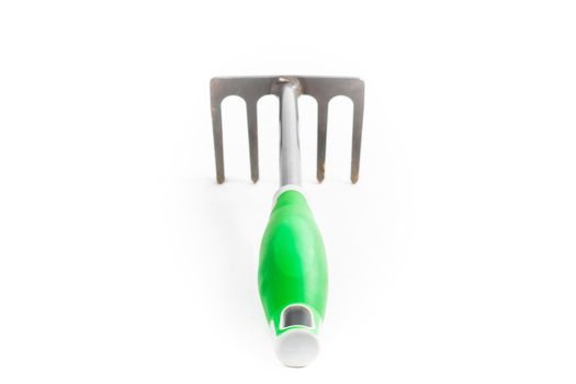 small rake gardening 5 teeth with green handle on white background