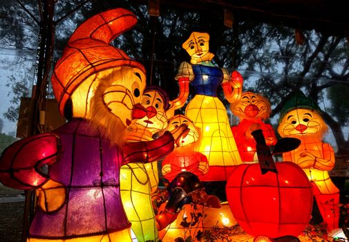 KAOHSIUNG, TAIWAN -- MARCH 6, 2015: Colorful lanterns to celebrate the Chinese year of the goat are on display along the banks of the Love River during the traditional Lantern Festival. Here pictured is Snowhite and the 7 Dwarfs