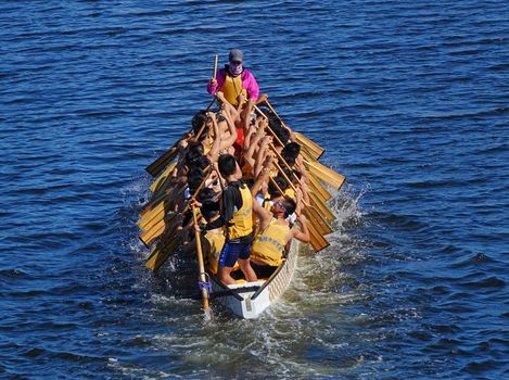KAOHSIUNG, TAIWAN -- MAY 27, 2016: An unidentified team trains on the Love River in preparation for the upcoming Dragon Boat Festival.
