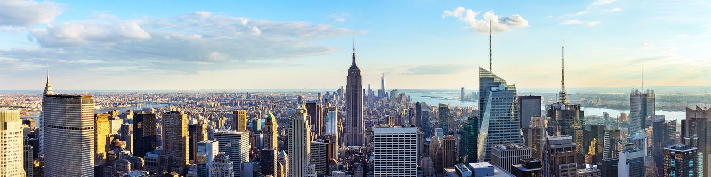 New York City skyline from roof top with urban skyscrapers before sunset.New York, USA. Panorama image.