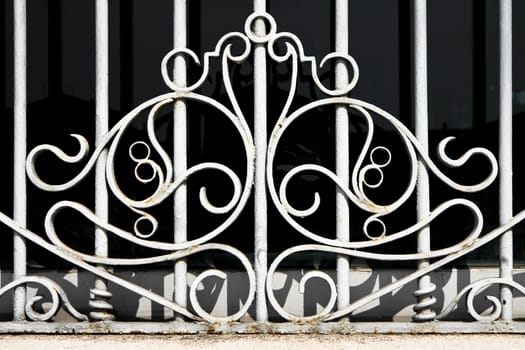 Old wrought iron grating with floral decorations