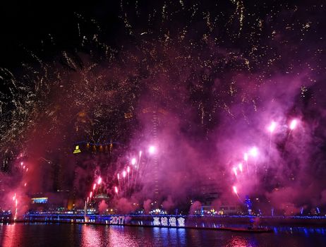 KAOHSIUNG, TAIWAN -- FEBRUARY 3, 2017: To celebrate the Chinese year of the Rooster fireworks are on display along the banks of the Love River during the traditional Lantern Festival.
