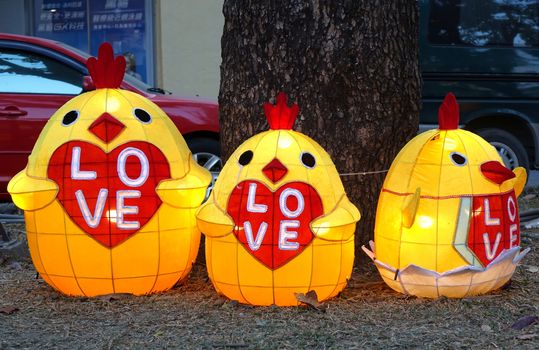KAOHSIUNG, TAIWAN -- FEBRUARY 3, 2017: Colorful lanterns in the shape of baby chicks are on display along the banks of the Love River during the traditional Lantern Festival.