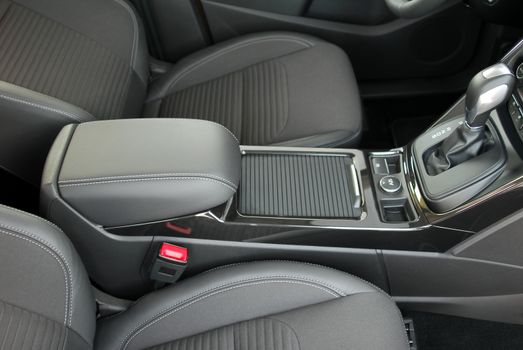 armrest in the luxury passenger car, detail in the interior