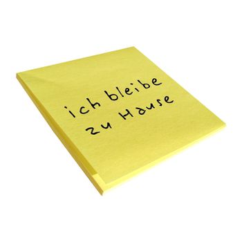 ich bleibe zu Hause (translation: I stay at home) sticky note isolated