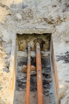 Work done on the cold and warm water pipes. A large hole was dug in the sandy ground