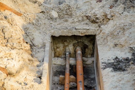 Work done on the cold and warm water pipes. A large hole was dug in the sandy ground