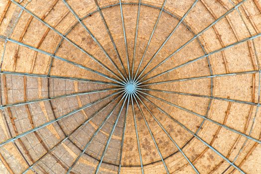 A dome made with Oriented Strand Board wood, also called OSB, with a metallic structure seen from below