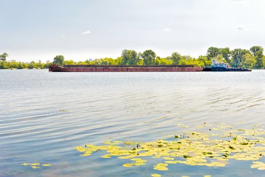 Barge on the Dnieper river during a sunny summer day