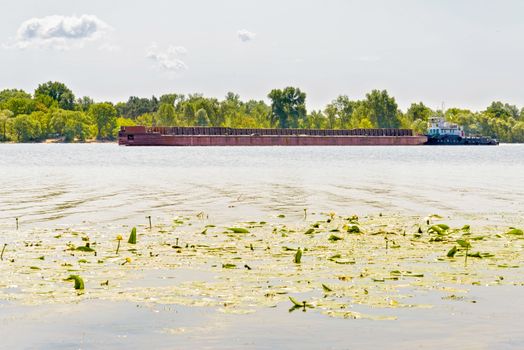 Barge on the Dnieper river during a sunny summer day