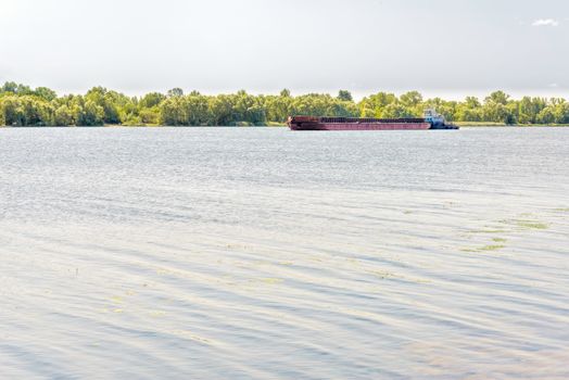 Barge on the Dnieper river during a sunny summer day