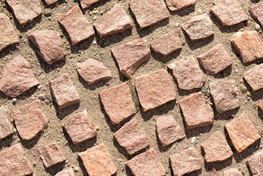 Detail of a pathway made of granite cobblestone