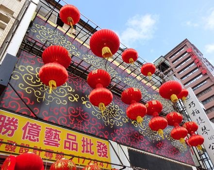 KAOHSIUNG, TAIWAN -- JANUARY 13, 2019: A store sells decorations for the Chinese New Year 2019. The storefront is decorated with large Chinese lanterns.