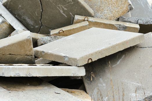 Detail of old and damaged reinforced concrete slabs on an abandoned construction site
