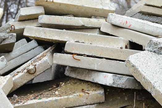 Detail of old and damaged reinforced concrete slabs on an abandoned construction site