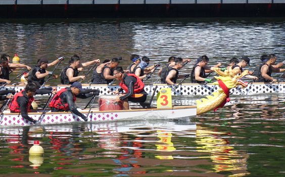 KAOHSIUNG, TAIWAN -- JUNE 7, 2019: Teams compete in the yearly  Love River dragon boat races.