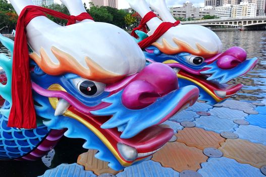 KAOHSIUNG, TAIWAN -- JUNE 1, 2019: Boats with the traditional dragon head sculpture design are prepared for the yearly Dragon Boat Races on the Love River.