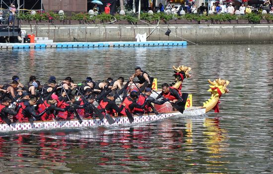 KAOHSIUNG, TAIWAN -- JUNE 7, 2019: Teams compete in the yearly  Love River dragon boat races.