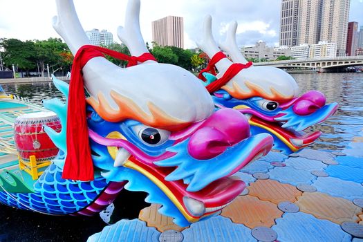 KAOHSIUNG, TAIWAN -- JUNE 1, 2019: Boats with the traditional dragon head sculpture design are prepared for the yearly Dragon Boat Races on the Love River.