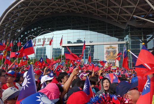 KAOHSIUNG, TAIWAN -- OCTOBER 10, 2019: An excited crowd waves national flags during the national day celebrations at a free, public event.