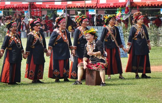 KAOHSIUNG, TAIWAN -- SEPTEMBER 28, 2019: Women of the indigenous Rukai tribe perform a dance during the traditional harvest festival.