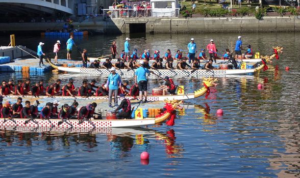 KAOHSIUNG, TAIWAN -- JUNE 7, 2019: Teams are positioning themselves at the starting line for the Love River dragon boat races.