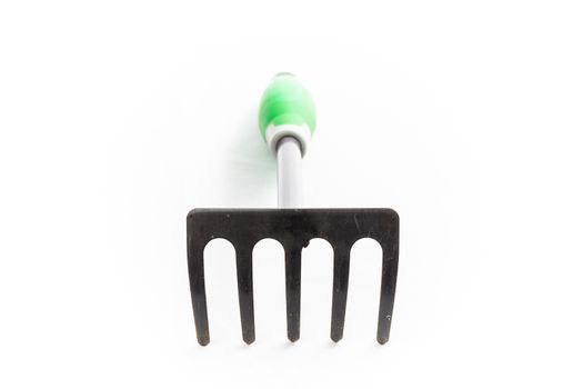 small rake gardening 5 teeth with green handle on white background