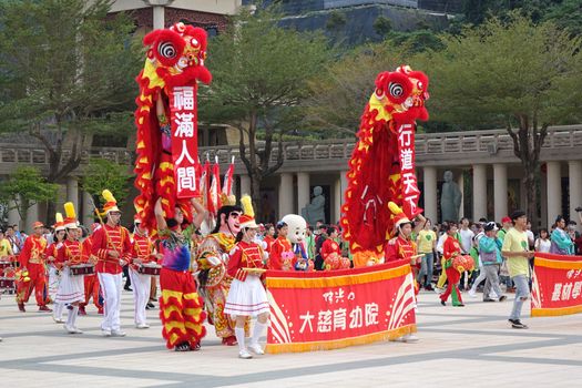 KAOHSIUNG, TAIWAN -- JANUARY 25, 2020: A parade at the Fo Guang Shan Buddhist complex during Chinese New Year. The Chinese characters mean "Da Zi Children's Home" and "Blessing for the New Year".
