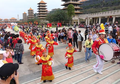 KAOHSIUNG, TAIWAN -- JANUARY 25, 2020: A parade at the Fo Guang Shan Buddhist complex during Chinese New Year with children dressed up as Chinese scholars.