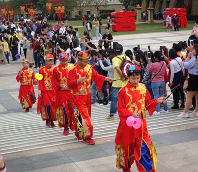 KAOHSIUNG, TAIWAN -- JANUARY 25, 2020: A parade at the Fo Guang Shan Buddhist complex during Chinese New Year with children dressed up as Chinese scholars.
