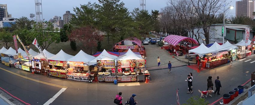 KAOHSIUNG, TAIWAN -- FEBRUARY 6, 2020: A panoramic view of street food vendors during the Chinese Lantern Festival.
