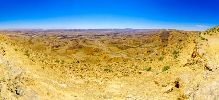 Panoramic landscape and winding road 225 in HaMakhtesh HaGadol (the big crater). It is a geological erosional landform in the Negev desert, Southern Israel