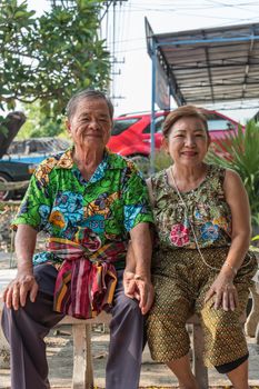 Asian young bathe with respect to parents by water have a jasmine and rose flower and aromatherapy in water in water bowl in Songkran Festival