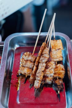 Mala is Grilled meat (Beef, Pork, Chickens or Mushroom) with chilli sauce and chinese hot spicy herb (Sichuan Pepper) for sale at Thai street food market or restaurant in Bangkok Thailand