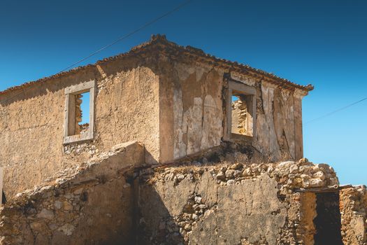 architectural detail of an old house in ruins on the seaside in Portugal