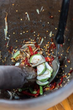 Papaya salad or Papaya Pok Pok (Som tum) for sale at Thai street food market or restaurant in Thailand