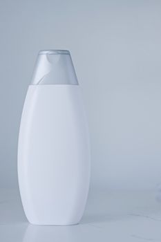 Blank label cosmetic container bottle as product mockup on gray background, hygiene and healthcare