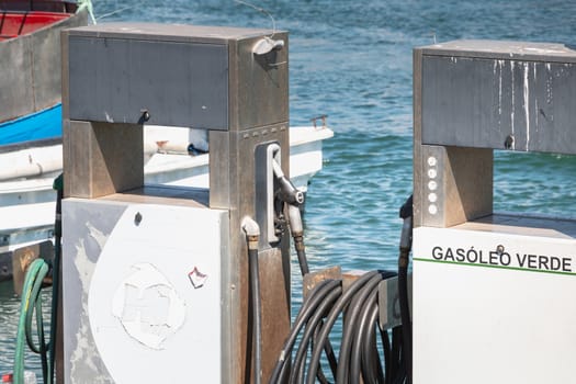 Setubal, Portugal - August 8, 2018: In the fishing harbor on a summer day, a gas station reserved to fishing boats