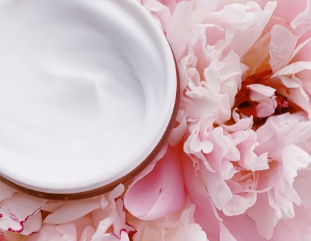 Face cream moisturizer on floral background as luxury skincare cosmetics, healthcare and beauty product concept